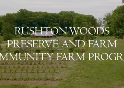 Picture of a farm in springtime and the words "Rushton Woods Preserve and Farm Community Farm Program"
